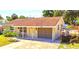 Tan single story house with carport and small yard at 6220 5Th S Ave, St Petersburg, FL 33707