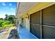Covered porch with chair and screened garage door at 6220 5Th S Ave, St Petersburg, FL 33707