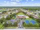 Aerial view of community with pool, tennis courts, and clubhouse at 2711 Coldstone Ln, Holiday, FL 34691