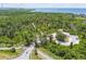 Aerial view showing a park entrance and surrounding natural landscape at 2711 Coldstone Ln, Holiday, FL 34691