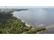 Aerial view of waterfront property with lush vegetation at 2711 Coldstone Ln, Holiday, FL 34691