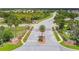 Gated community entrance with palm trees and landscaping at 2711 Coldstone Ln, Holiday, FL 34691