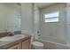 Simple bathroom with shower/tub combo and vanity at 2711 Coldstone Ln, Holiday, FL 34691