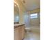 Clean bathroom with shower/tub combo and wood vanity at 2711 Coldstone Ln, Holiday, FL 34691