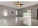 Bright and airy living room with sliding doors to patio at 2711 Coldstone Ln, Holiday, FL 34691