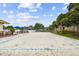 Sand volleyball court with net at 2711 Coldstone Ln, Holiday, FL 34691