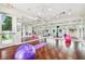 Yoga and Pilates studio with hardwood floors and large mirrors at 2711 Coldstone Ln, Holiday, FL 34691