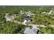 Aerial view of a house on a tree-lined street at 9333 Hialeah Ter, Port Charlotte, FL 33981