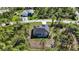 New home with backyard and spacious lot, surrounded by lush greenery at 9333 Hialeah Ter, Port Charlotte, FL 33981
