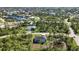 Aerial view showing a home nestled in a quiet neighborhood at 9333 Hialeah Ter, Port Charlotte, FL 33981