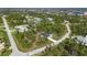 New home with backyard and spacious lot, surrounded by lush greenery at 9333 Hialeah Ter, Port Charlotte, FL 33981