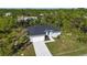 Aerial view of house, driveway, and lot at 9333 Hialeah Ter, Port Charlotte, FL 33981