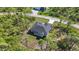 New home with backyard and spacious lot, surrounded by lush greenery at 9333 Hialeah Ter, Port Charlotte, FL 33981
