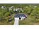 New single-Gathering home with driveway and landscaping; located in a wooded area at 9333 Hialeah Ter, Port Charlotte, FL 33981