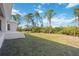 Landscaped backyard with grassy area at 9333 Hialeah Ter, Port Charlotte, FL 33981