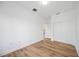 Bedroom with wood-look floors and double door closet at 9333 Hialeah Ter, Port Charlotte, FL 33981