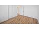 Bedroom with double door closet and wood-look floors at 9333 Hialeah Ter, Port Charlotte, FL 33981