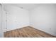 Spacious bedroom with wood-look floors and door at 9333 Hialeah Ter, Port Charlotte, FL 33981