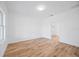 Bright bedroom with wood-look floors and access to a closet at 9333 Hialeah Ter, Port Charlotte, FL 33981