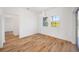 Bright dining room with hardwood floors and large windows at 9333 Hialeah Ter, Port Charlotte, FL 33981