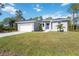 Single-story house with a grey exterior and a spacious yard at 9333 Hialeah Ter, Port Charlotte, FL 33981