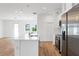 Modern kitchen features white cabinets and stainless steel appliances at 9333 Hialeah Ter, Port Charlotte, FL 33981