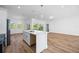 Modern kitchen with island, stainless steel appliances, and white cabinetry at 9333 Hialeah Ter, Port Charlotte, FL 33981