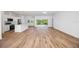 Bright and spacious living area with hardwood floors and sliding glass doors at 9333 Hialeah Ter, Port Charlotte, FL 33981