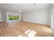 Open living area with hardwood floors and access to the backyard at 9333 Hialeah Ter, Port Charlotte, FL 33981