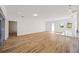 Open living room with hardwood floors and access to patio at 9333 Hialeah Ter, Port Charlotte, FL 33981