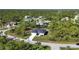 Aerial view of house and surrounding homes at 9333 Hialeah Ter, Port Charlotte, FL 33981