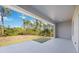 Covered patio overlooking the backyard and wooded area at 9333 Hialeah Ter, Port Charlotte, FL 33981