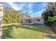 Spacious backyard offering a large grassy area at 17734 1St E St, Redington Shores, FL 33708