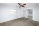 Bedroom with mirrored closet doors and herringbone floors at 17734 1St E St, Redington Shores, FL 33708