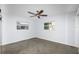 Bright bedroom featuring hardwood floors and two large windows at 17734 1St E St, Redington Shores, FL 33708