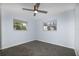 Bright bedroom with herringbone floors and ceiling fan at 17734 1St E St, Redington Shores, FL 33708