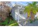 Side view of the house with white brick exterior at 17734 1St E St, Redington Shores, FL 33708