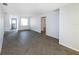 Open living area with herringbone floors and access to other rooms at 17734 1St E St, Redington Shores, FL 33708