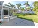 Screened-in porch overlooking a lush green backyard at 17734 1St E St, Redington Shores, FL 33708