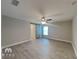 Bright bedroom with tile floors and a ceiling fan at 12731 N Ola Ave, Tampa, FL 33612