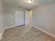 Spacious bedroom with double door closet and tile floors at 12731 N Ola Ave, Tampa, FL 33612