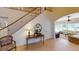 Entryway featuring a staircase, console table, and glimpse of living area at 5198 Legend Hills Ln, Brooksville, FL 34609