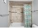 Bathroom with bathtub and patterned shower curtain at 2333 Feather Sound Dr # A203, Clearwater, FL 33762