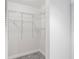 White closet with wire shelving and hanging rods at 2333 Feather Sound Dr # A203, Clearwater, FL 33762