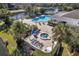 Community pool and spa with lounge chairs and landscaping at 2333 Feather Sound Dr # A203, Clearwater, FL 33762