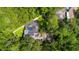 Aerial view showing house, solar panels, pool, and fenced backyard at 601 Seven Oaks Ct, Brooksville, FL 34601