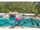 Relax in the screened pool and spa with a fun floatie in this oasis at 601 Seven Oaks Ct, Brooksville, FL 34601