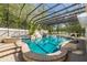 Enjoy this luxurious pool and spa with a rock waterfall feature at 601 Seven Oaks Ct, Brooksville, FL 34601