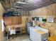 Functional laundry room with washer, dryer, and ample storage at 1026 Roosevelt Ave, Spring Hill, FL 34604