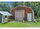 Metal workshop with large roll-up door at 1026 Roosevelt Ave, Spring Hill, FL 34604